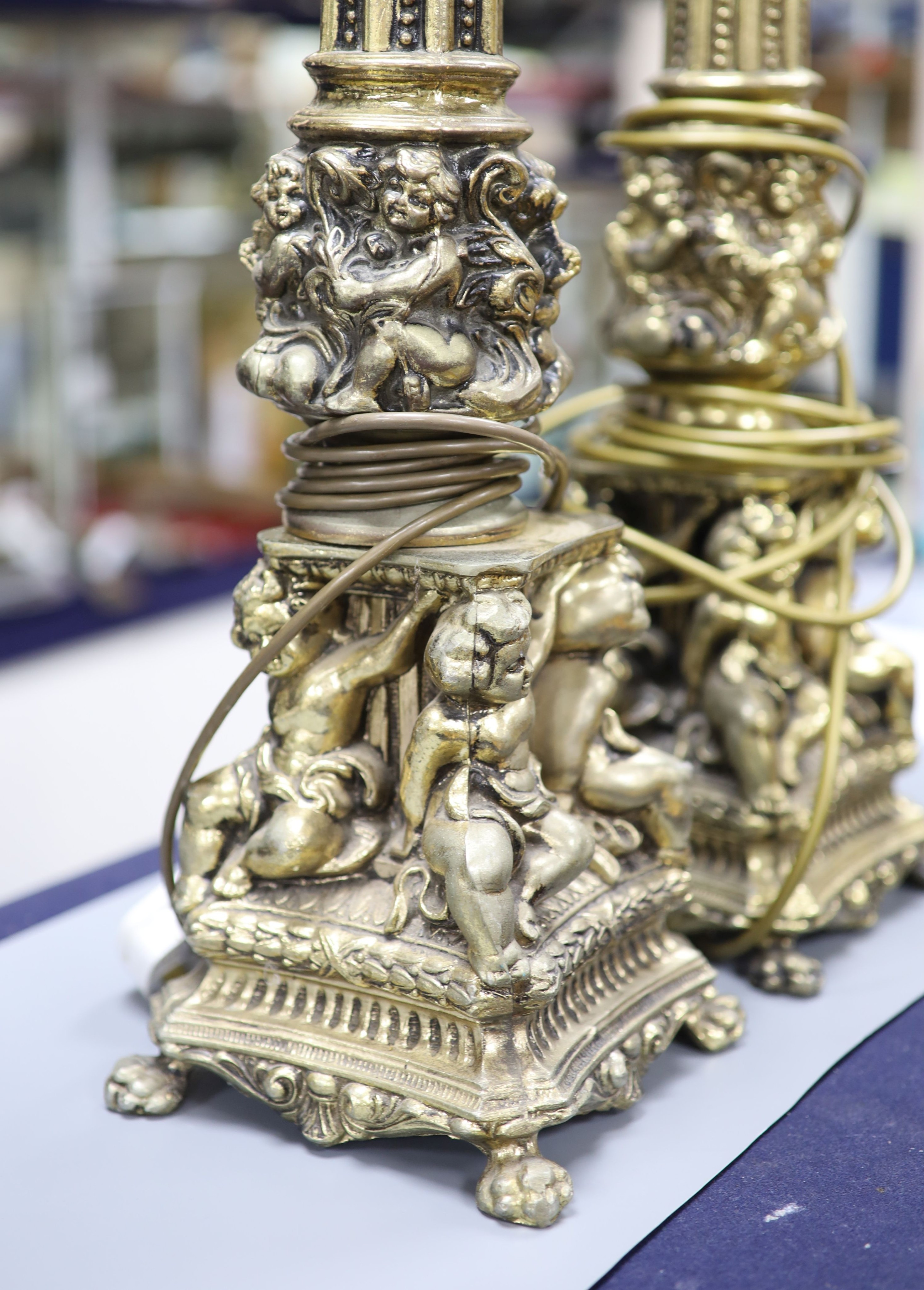 A pair of gilt metal column lamp bases, total height 61 cm